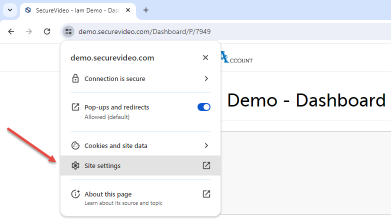 Arrow pointing to the dropdown menu for site settings